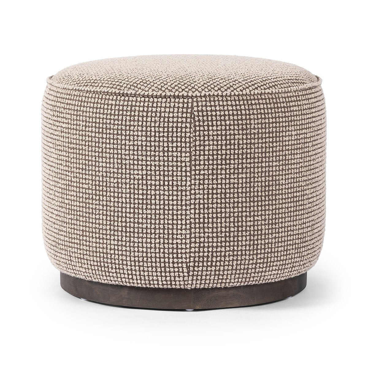 The Round Ottoman features textured beige fabric upholstery and a dark, solid base, displayed against a white background.