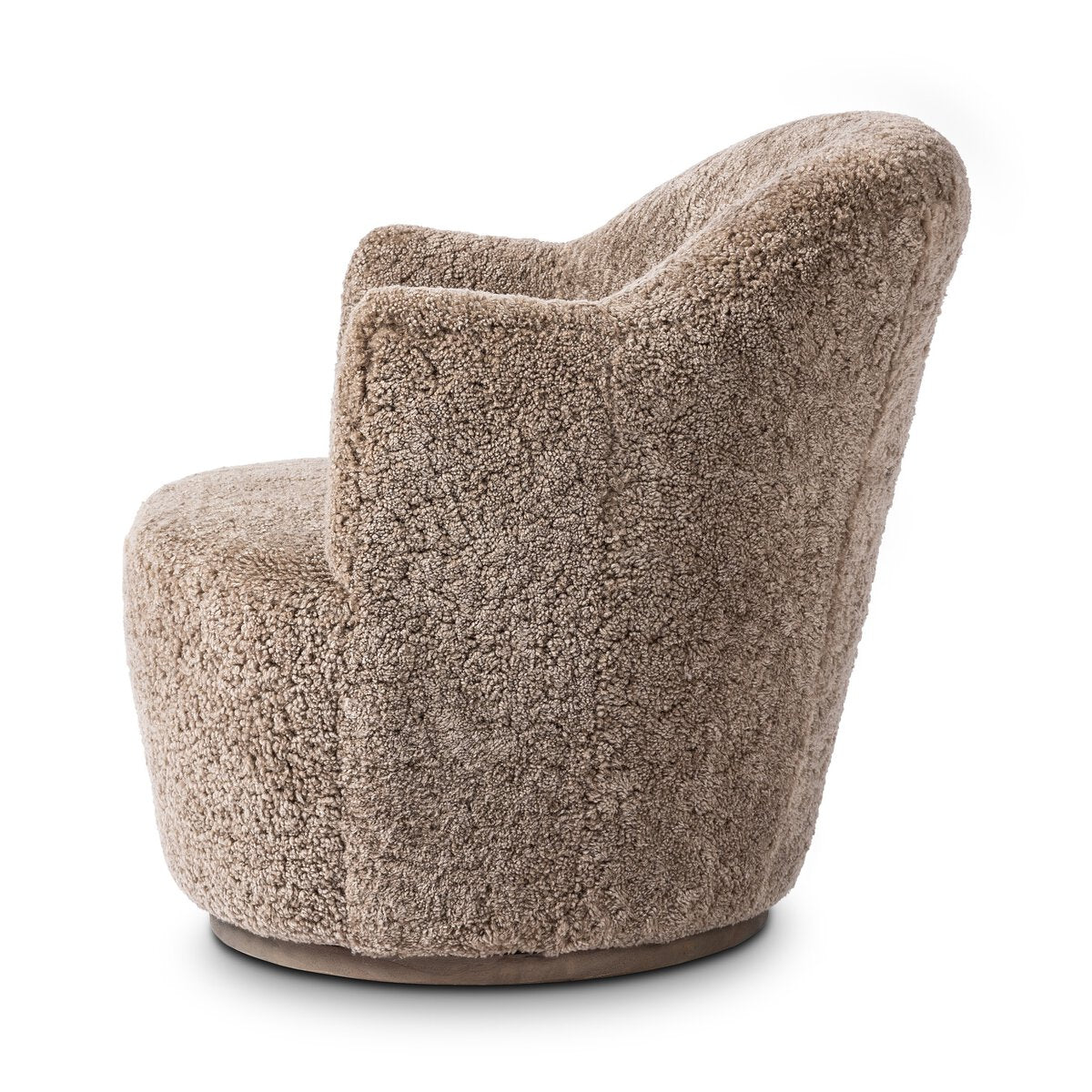 A side view of the Shierling Taupe Swivel Chair, a plush modern armchair with a rounded back and seat, upholstered in soft textured taupe fabric, and set on a flat circular base.