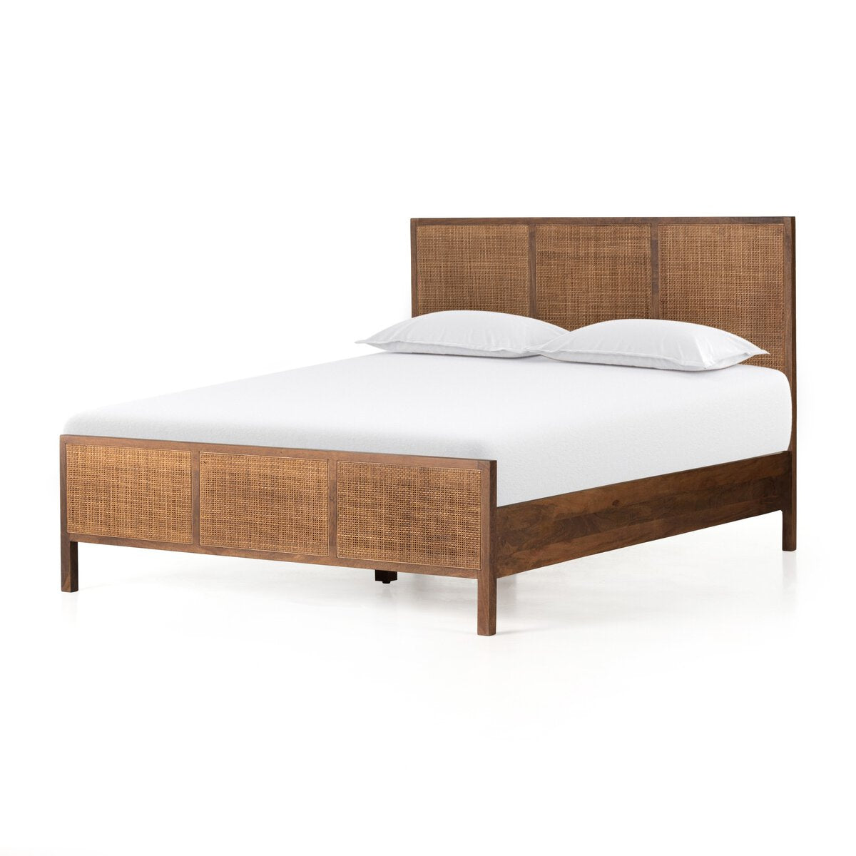 The Brown Mango Bedframe, queen size with woven rattan panels on the headboard and footboard, includes a white mattress and two white pillows, all set against a plain white background.
