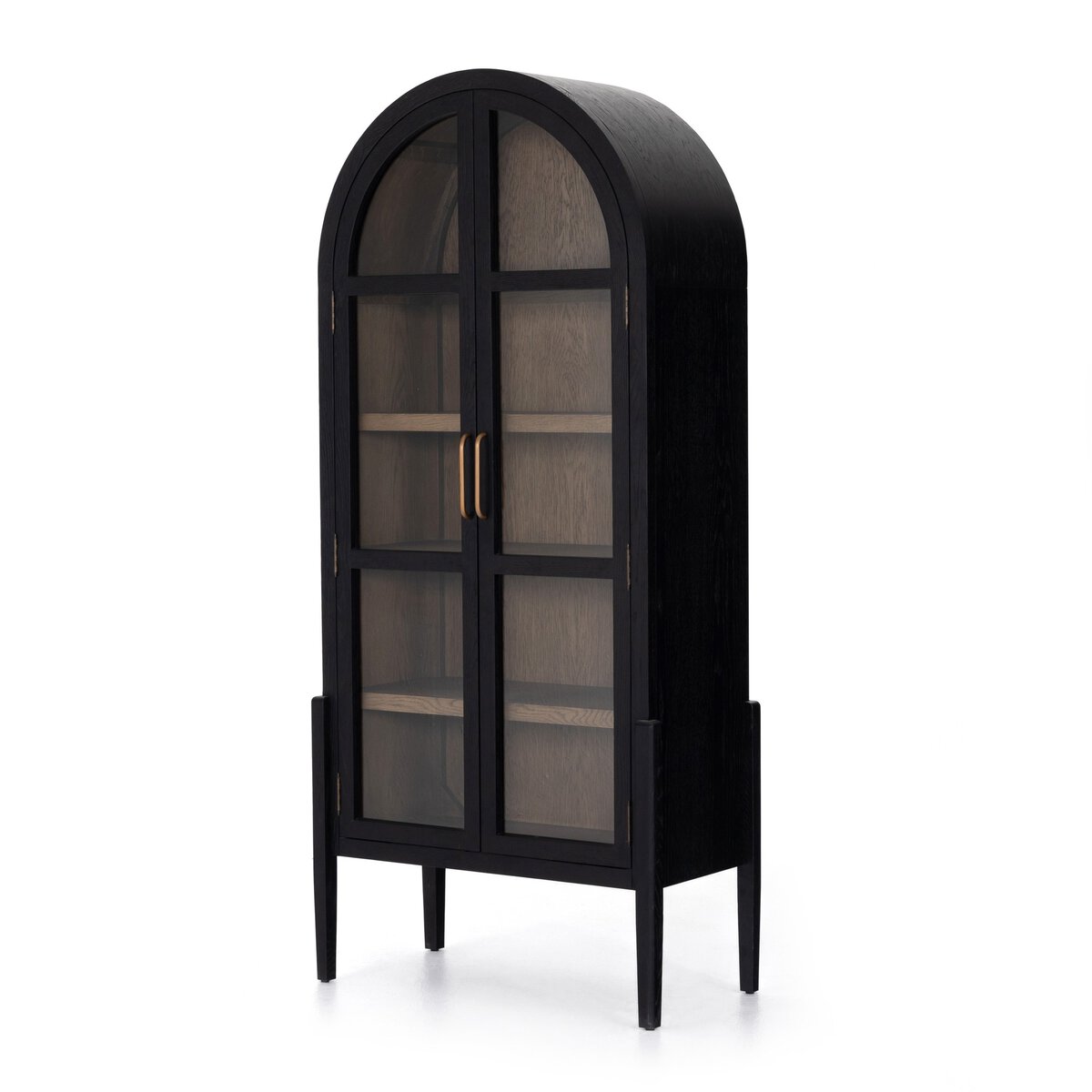 The Black Oak Arched Cabinet features an arched top, glass double doors with gold handles, slender legs, and multiple interior shelves—offering elegant storage in a tall, narrow design.