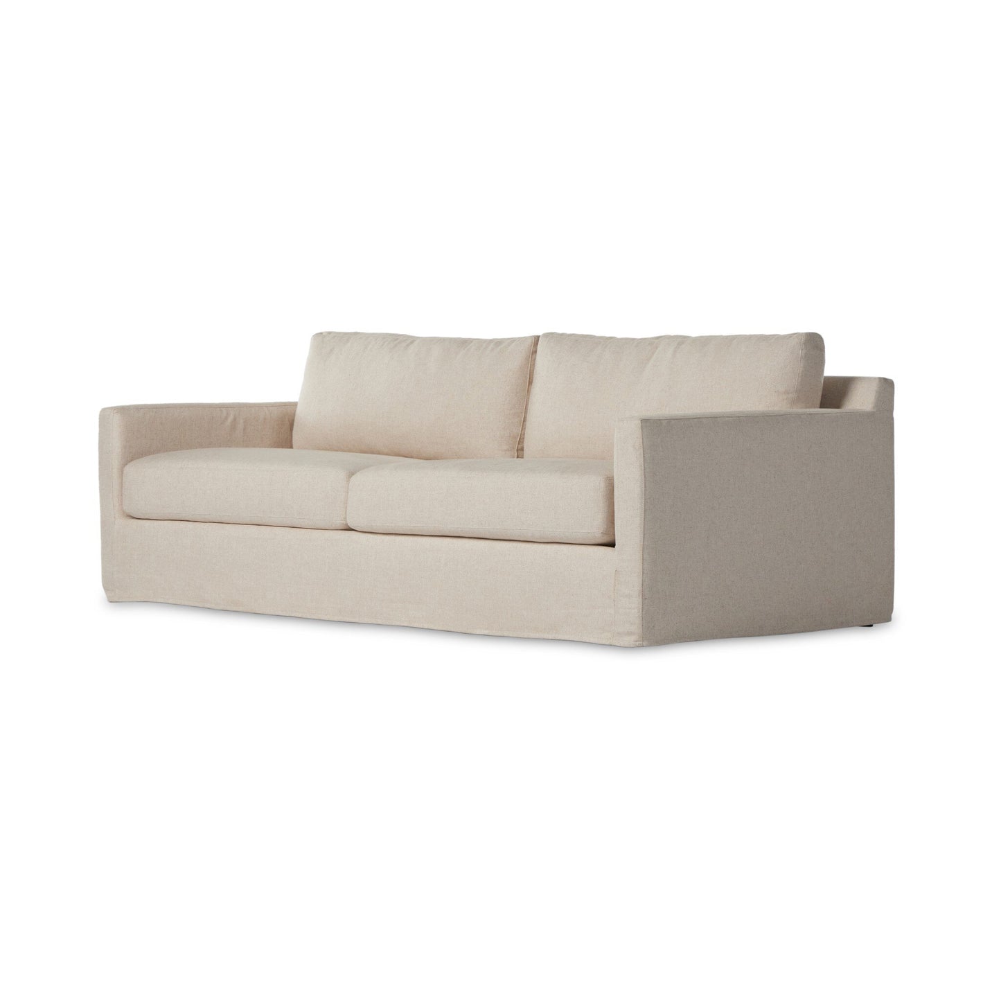The Hampton Slipcover Sofa is a modern, beige three-seat sofa with straight arms and plush cushions, shown against a white background to emphasize its sleek design.