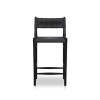 The Lomas Bar + Counter Outdoor Stool features a black wooden frame, a rectangular seat, a low cut-out backrest, straight legs with support bars, and dimensions ideal for most kitchen or bar spaces.