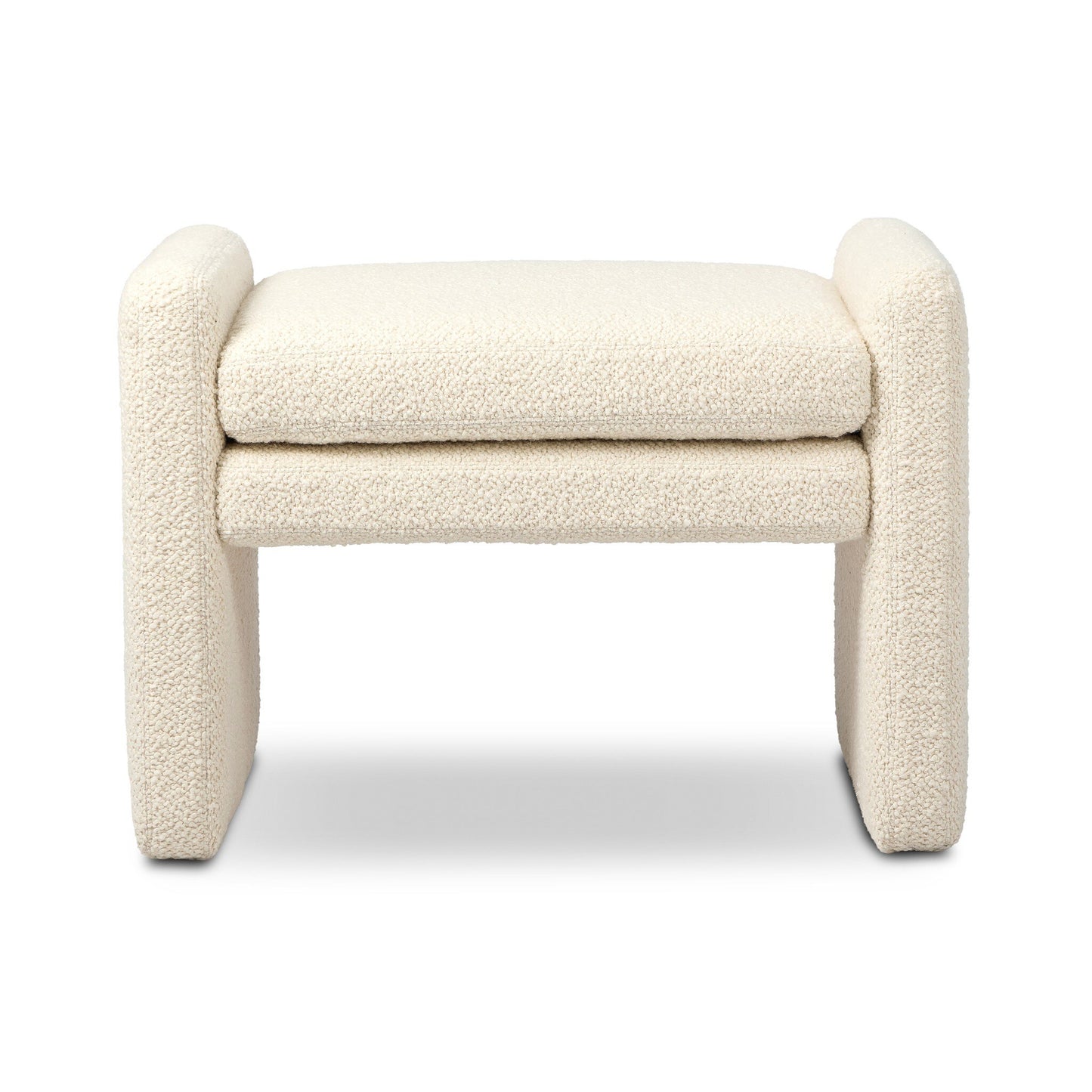 The Serena Ottoman features a modern, minimalist design with a rectangular cushioned seat, thick rounded arms and legs, and soft cream textured upholstery. Its compact 26.00"w x 18.00"d size is ideal for stylish seating anywhere.