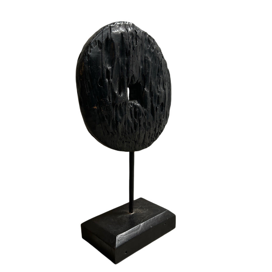 EBONIZED WOOD DISC ON STAND