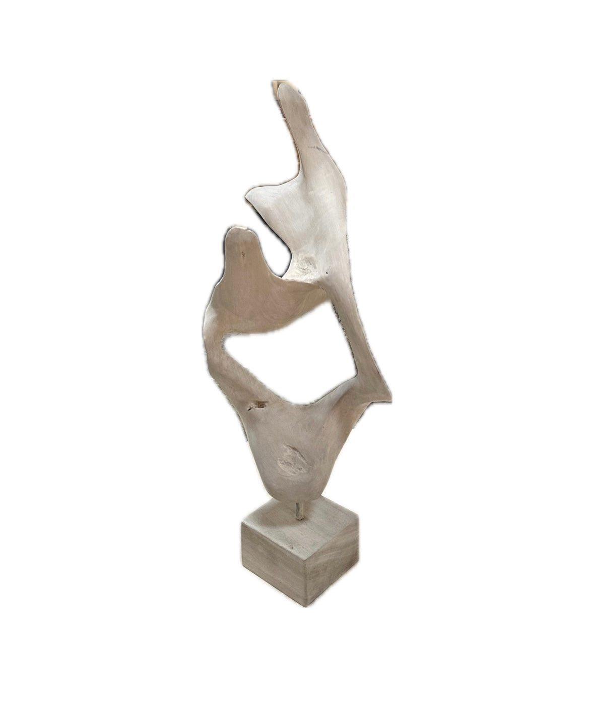 The Bleached Wood Sculpture features smooth curves, an open center, and a natural wood texture. Mounted on a square base, this elegant piece of wood art displays organic shapes and flowing lines against a white background.