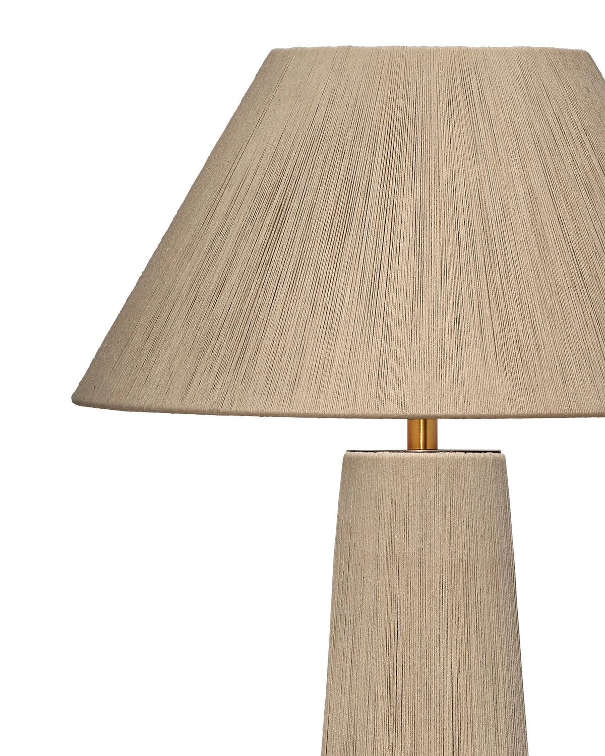 A close-up of the Jute Floor Lamp, showcasing its beige, textured fabric-like surface on both the wide lampshade and cylindrical base, with an E26 bulb socket, set against a white background.