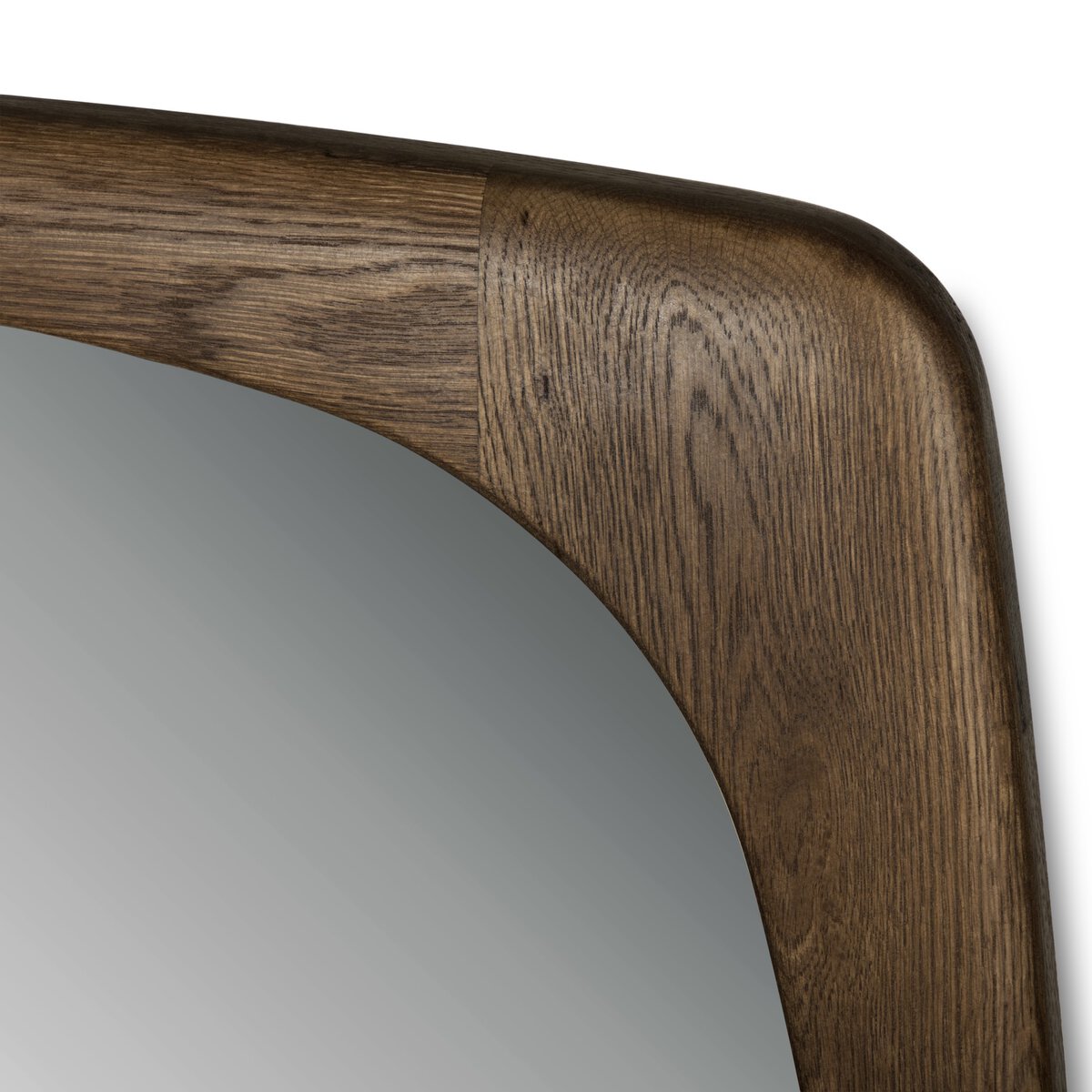 Close-up of the top right corner of the Jai Wall Mirror, featuring a rectangular Cocoa Oak frame with visible wood grain and smooth finish. The reflective surface is partially shown. Overall dimensions: 36"w x 2"d x 43"h.