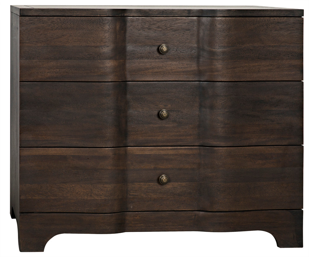 The Claudie Chest, Ebony Walnut, is handcrafted with three drawers featuring round metal knobs, wavy ripple-effect fronts, and stands on gently curved legs for an elegant look.