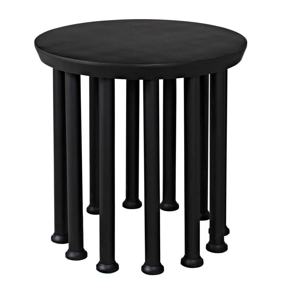 The Lila Side Table, Black Iron, showcases a matte black finish, smooth round top, and twelve evenly spaced cylindrical legs with rounded feet—offering a perfect mix of modern style and elegance.