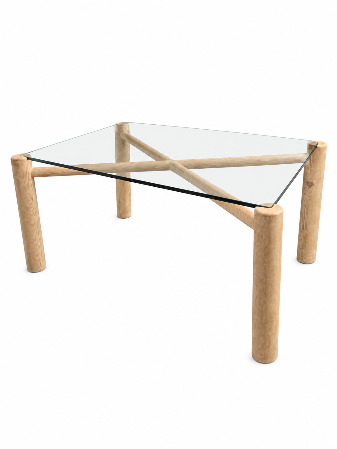The Wood and Glass Dining Table features a modern 60-inch clear glass top supported by three thick, cylindrical wooden legs in a triangular layout—ideal for dining or as a stylish workspace.