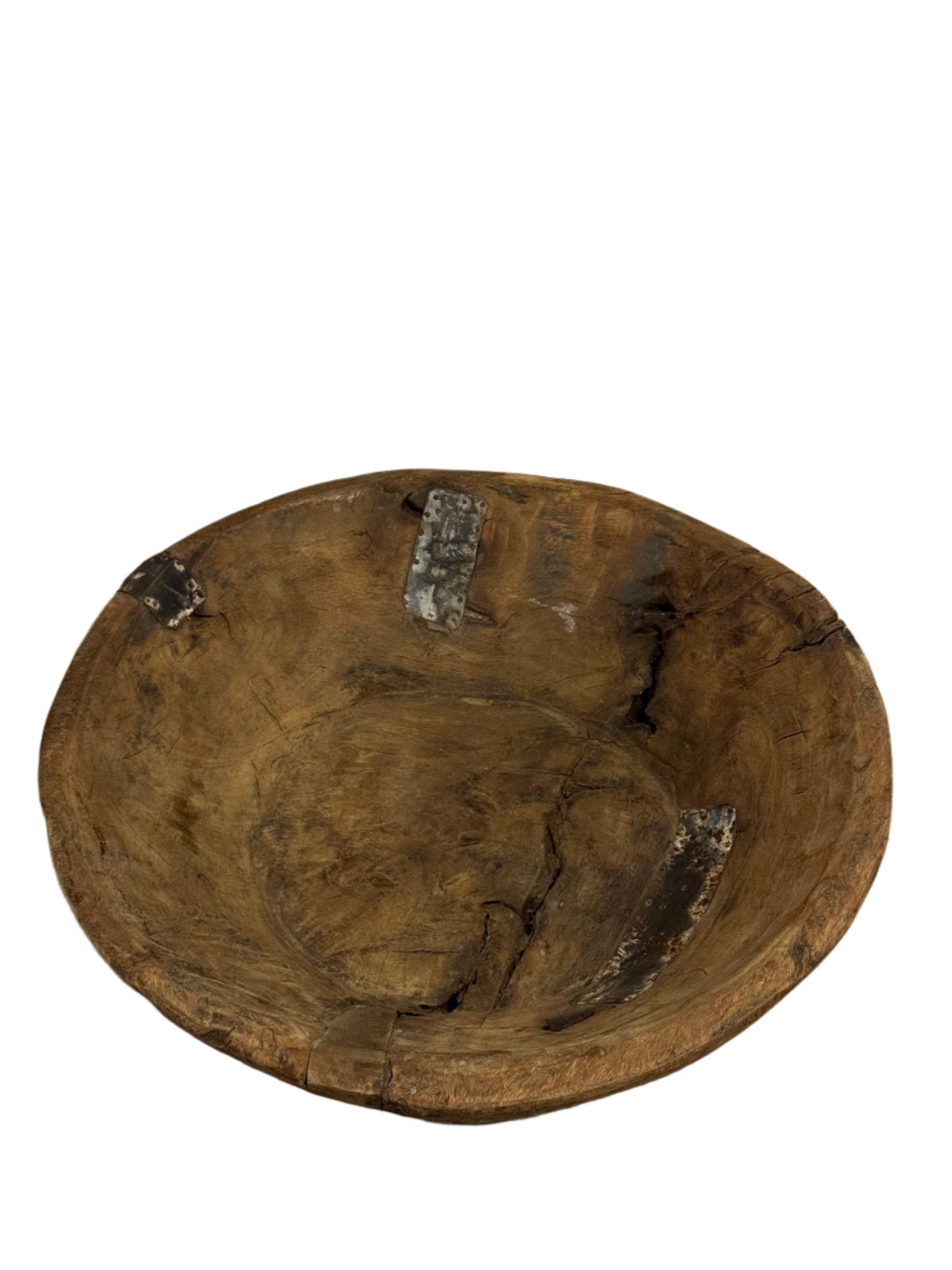 The Natural Wood & Metal Trim Platter is a rustic 17-inch round tray with visible cracks, dark metal patches, and a weathered finish—its rough, uneven surface makes it a unique decorative accent for your home.