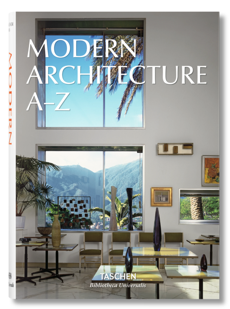 The cover of Modern Architecture A–Z features a bright, modern interior with large windows, mountain and palm tree views, and minimalist furnishings that reflect innovative architectural styles.