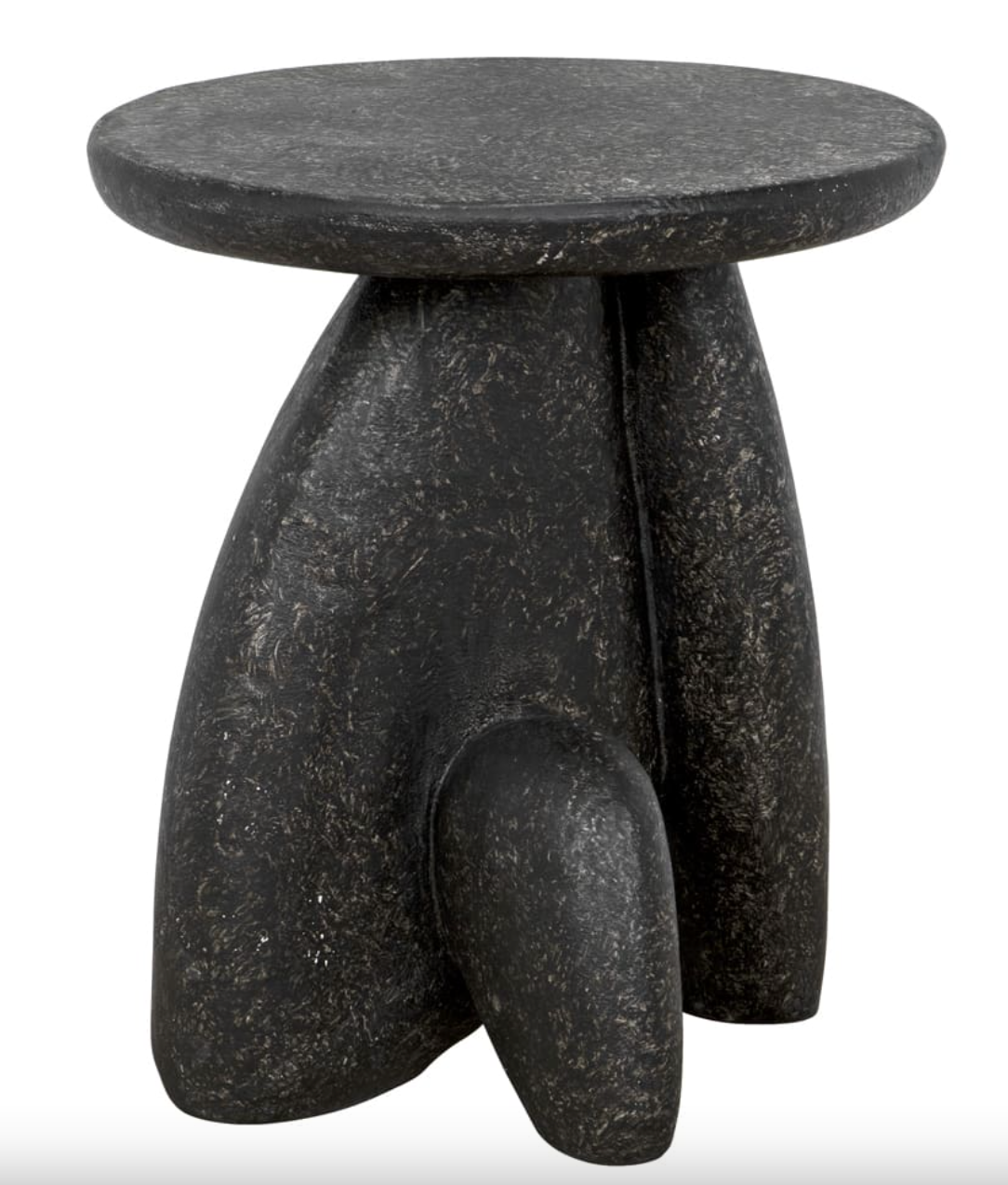 The Rock Formation Side Table is a compact, round fibercement piece featuring a black stipple finish and three outwardly curved sculptural legs for a contemporary, artistic look.