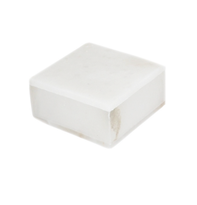 A medium alabaster square box with smooth surfaces and slightly rounded edges, photographed on a white background—an elegant decorative tabletop object inspired by European heritage.