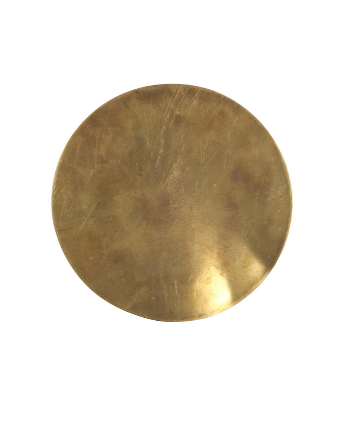 A Round Brass Trivet with a 10-inch diameter features a slightly worn, scratched surface and is shown against a plain white background.