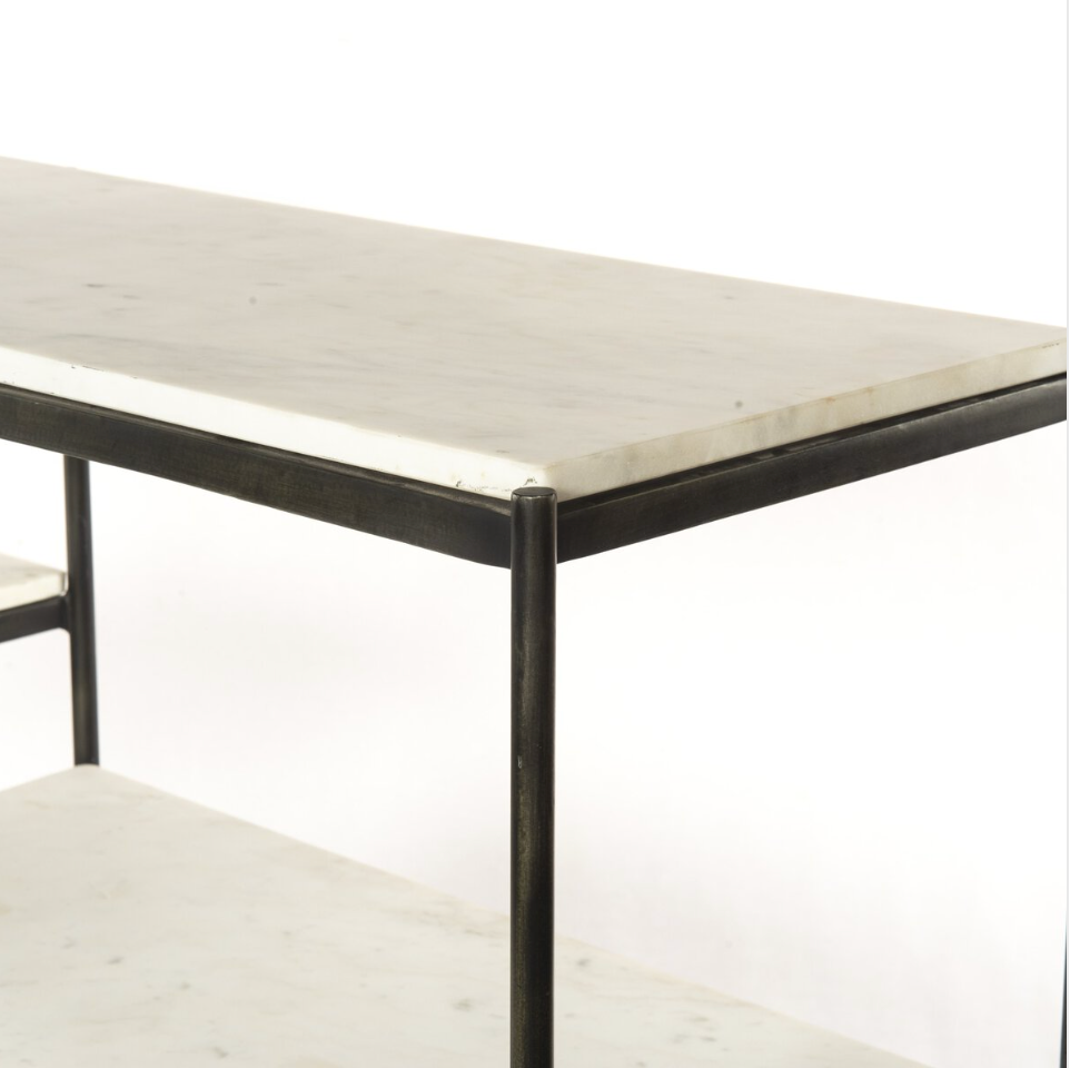 A close-up of the Hammered Metal Console Table, showcasing its rectangular white marble top, slim iron frame, lower marble shelf, and minimalist design against a plain white background.