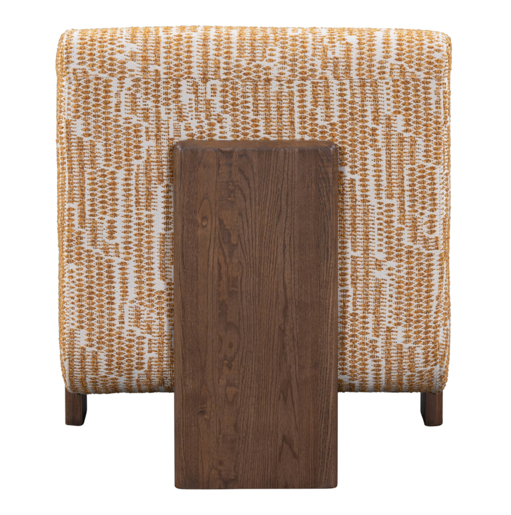 A back view of the Upholstered Mid Century Accent Chair in white and orange (28.75"W x 33.50"D x 32.00"H) with a dark wooden rectangular table directly in front.