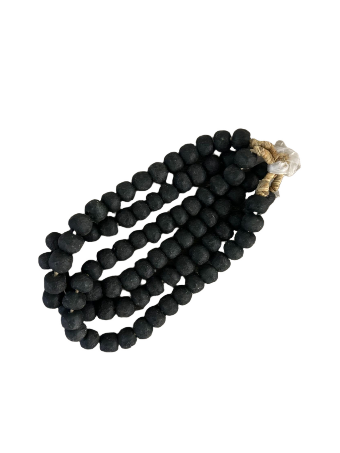 The Small Black Bead Necklace features three strands of large, round black beads (approx. 0.75" diameter), tied at one end with light-colored twine and displayed on a white background.