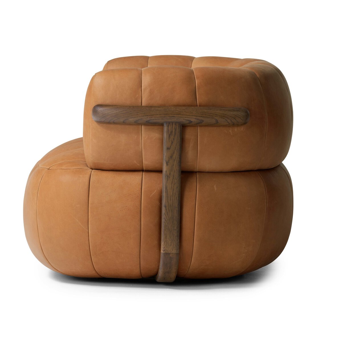The Media Style Swivel Chair features modern tan leather, a rounded tufted cushion, and a dark wood T-shaped back support, shown on a white background—perfect for pairing with sofas or furniture of many sizes.