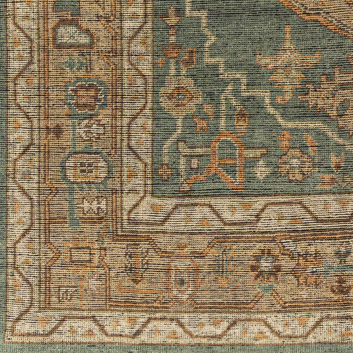 A close-up of the Traditional Dark Green and Beige Rug - 8'x10', showing ornate geometric and floral patterns in green, beige, tan, and rust with a decorative border—available in multiple sizes.