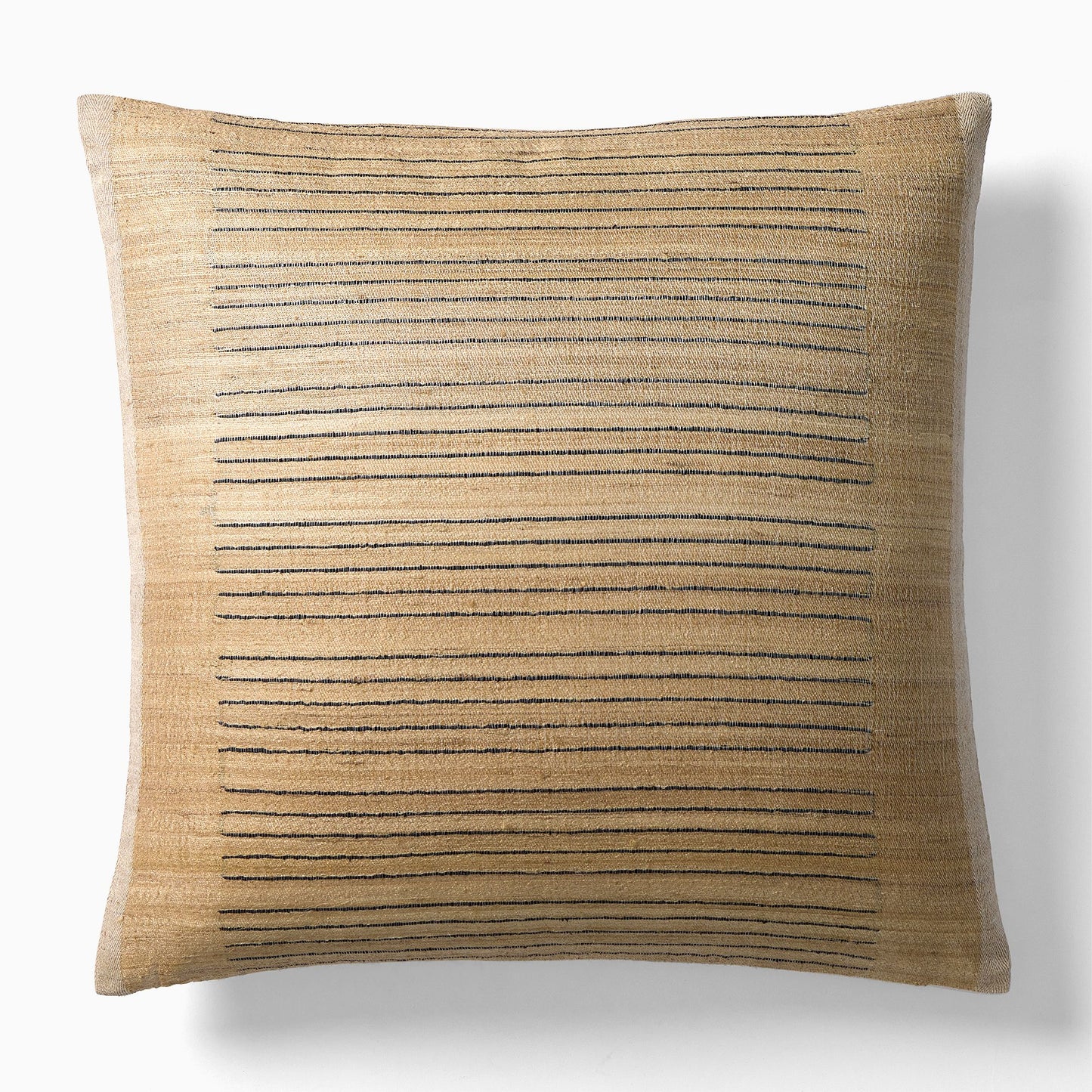 The Lined Camel Pillow is a 20-inch square decorative pillow featuring a beige background with grouped horizontal black stitched lines for a modern geometric look, shown on a plain white surface.