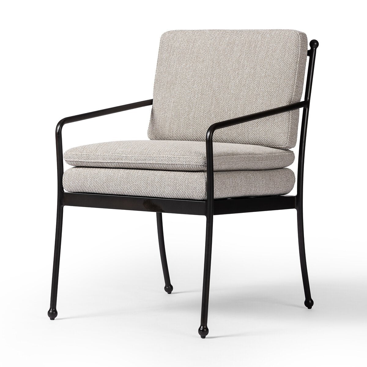 The Tally Outdoor Chair features a black metal frame with thin arms and legs, plus light beige upholstered seat and back cushions. Its minimalist, contemporary style measures 28.00"w x 35.50"h x 34.50"d.