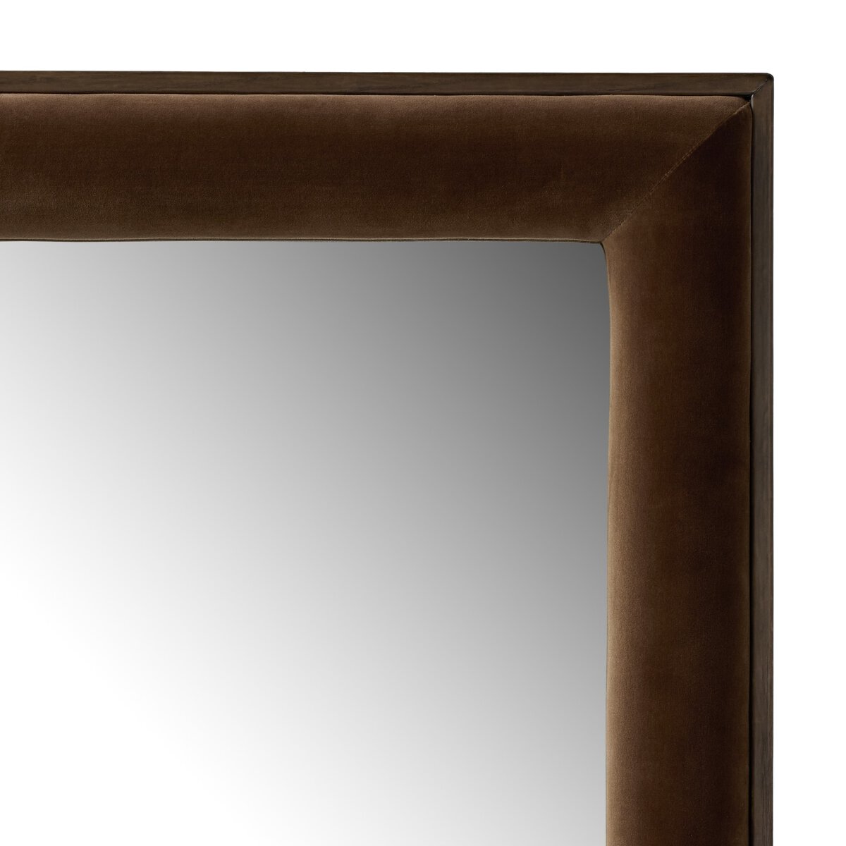 A close-up of the top left corner of the Velaz Floor Mirror, featuring a thick, dark brown velvet-covered frame. The 42x80-inch rectangular mirror reflects light, creating a gradient effect from left to right.