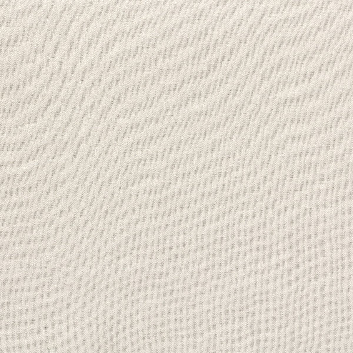 A close-up of plain, light beige fabric with a subtle woven texture and soft creases—perfect for the washable hemp upholstery featured in the Outdoor Slipcover Sofa.
