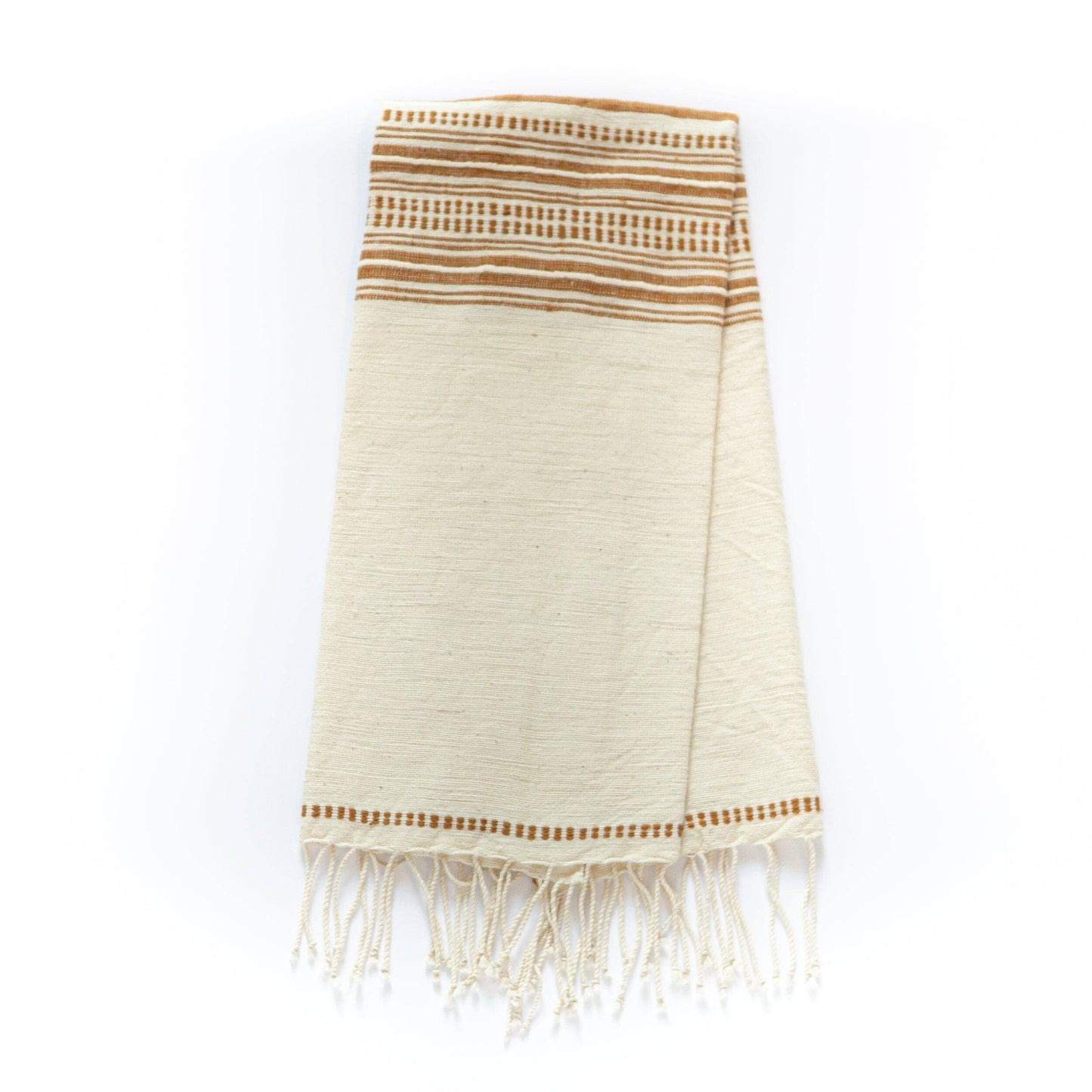 The Handwoven Ethiopian Cotton Hand Towel is cream-colored with brown horizontal stripes and decorative fringe along the bottom edge, shown folded on a white background.