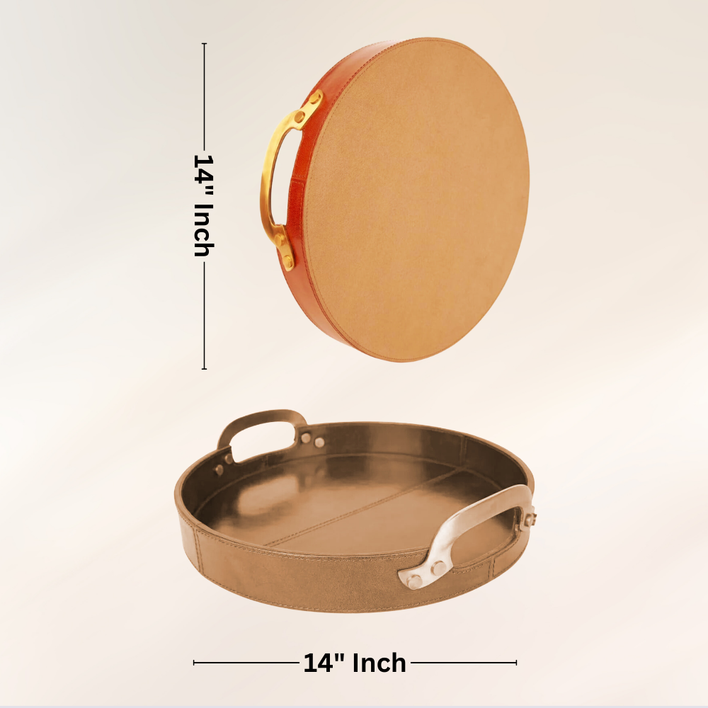 The Round Leather Stitched Tray with Brass Handle is shown upright and flat; each 14-inch tray features wood, leather, and brass accents for a stylish, modern look perfect as a decorative serving tray.