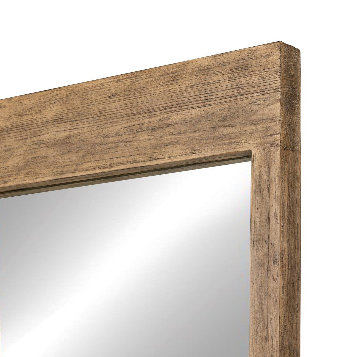 Close-up of the top corner of the Ledge Floor Mirror, featuring a thick, light brown wooden frame with visible wood grain. The 60x84 mirror reflects light and highlights its clean, simple design.