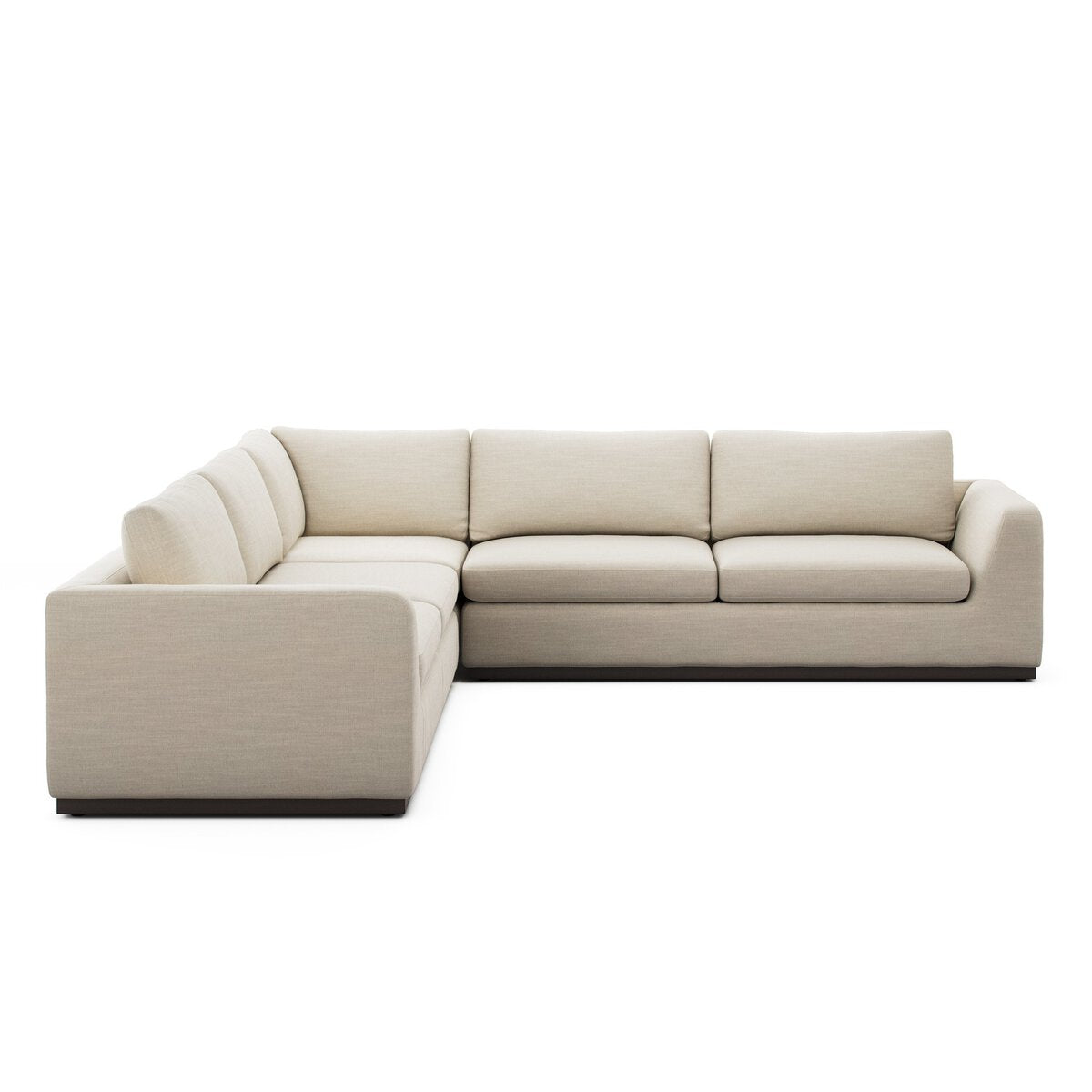 The Simple Modular Corner Sectional is a modern L-shaped sofa with light beige heirloom leather upholstery, thick cushions, clean lines, and a low-profile design. It is shown against a white background.