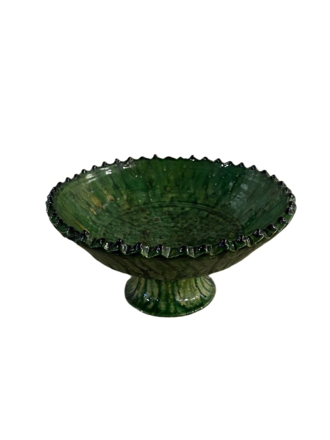 The Glazed Green Pedestal Bowl features a scalloped edge and glossy ceramic finish, displayed against a white background.