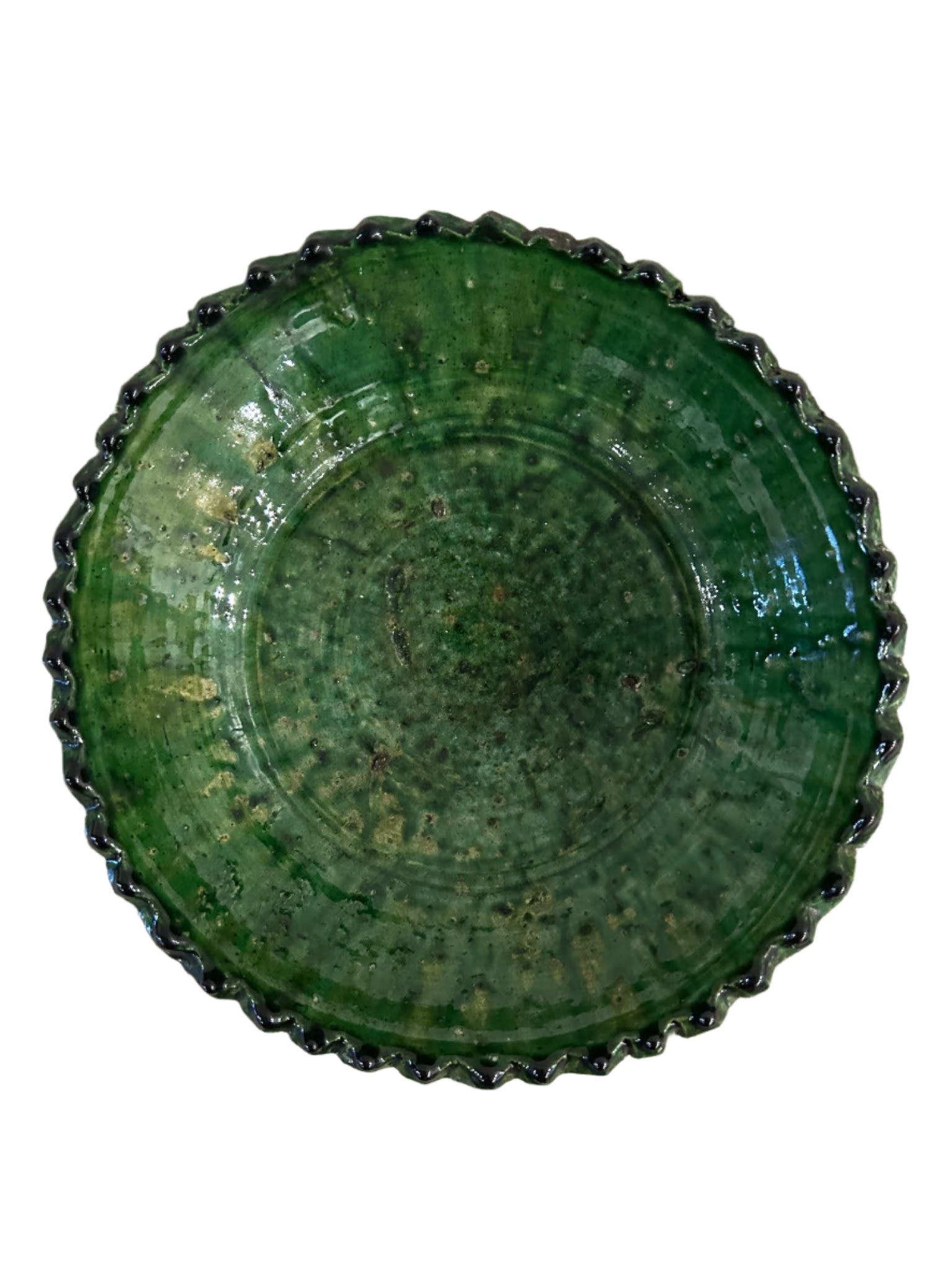 A round, green Glazed Green Pedestal Bowl with a textured, glossy finish and scalloped edge is shown from above on a white background.