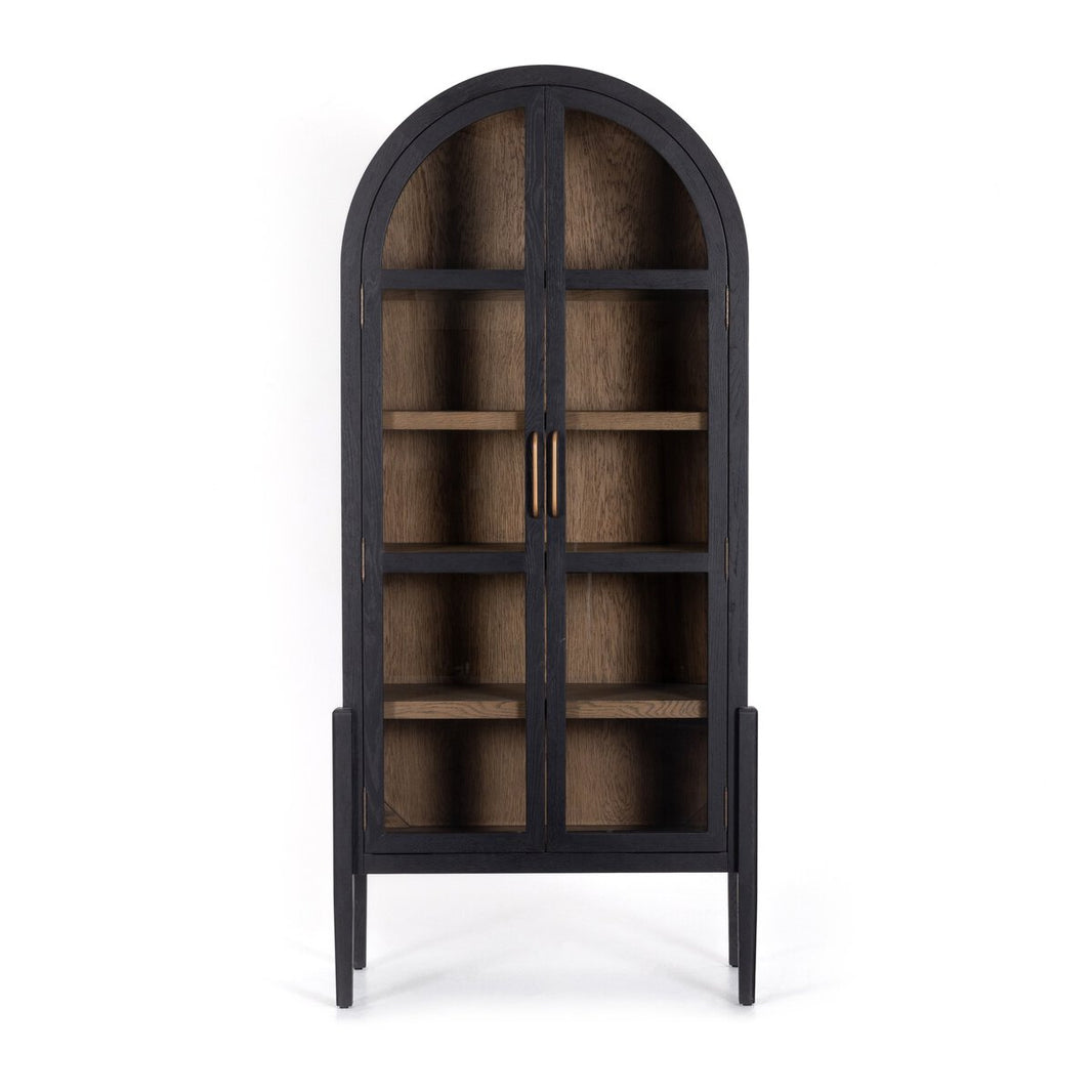 The Black Oak Arched Cabinet features a tall, black wooden frame with an arched top, glass double doors, brass handles, four shelves inside, a lighter wood interior, and stands on four legs—combining elegance with functional storage.