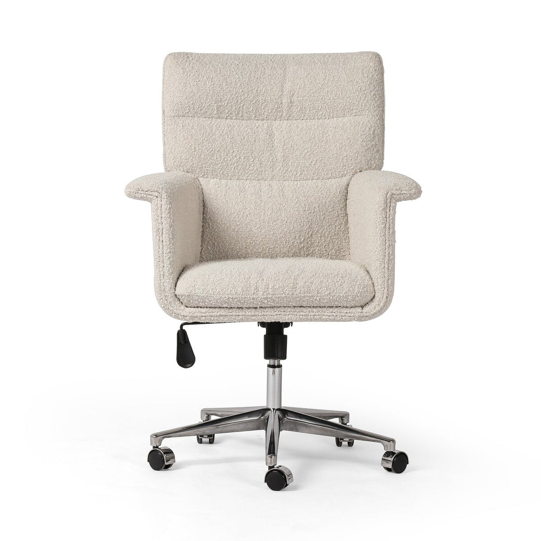 The Wing Arm Desk Chair features textured off-white upholstery, padded armrests, a high backrest, a metal base with five black caster wheels, and an adjustable height lever for modern ergonomic comfort.