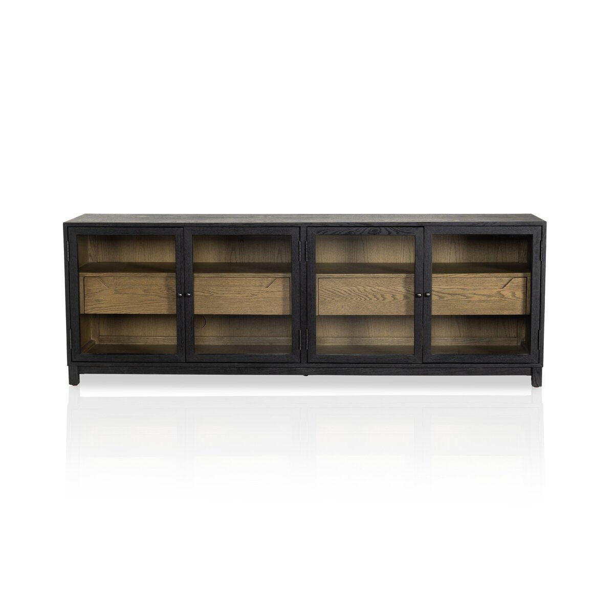 The Two-Tone Glass Media Cabinet features black drifted oak, four glass doors, and wooden interior drawers, showcased against a white background.