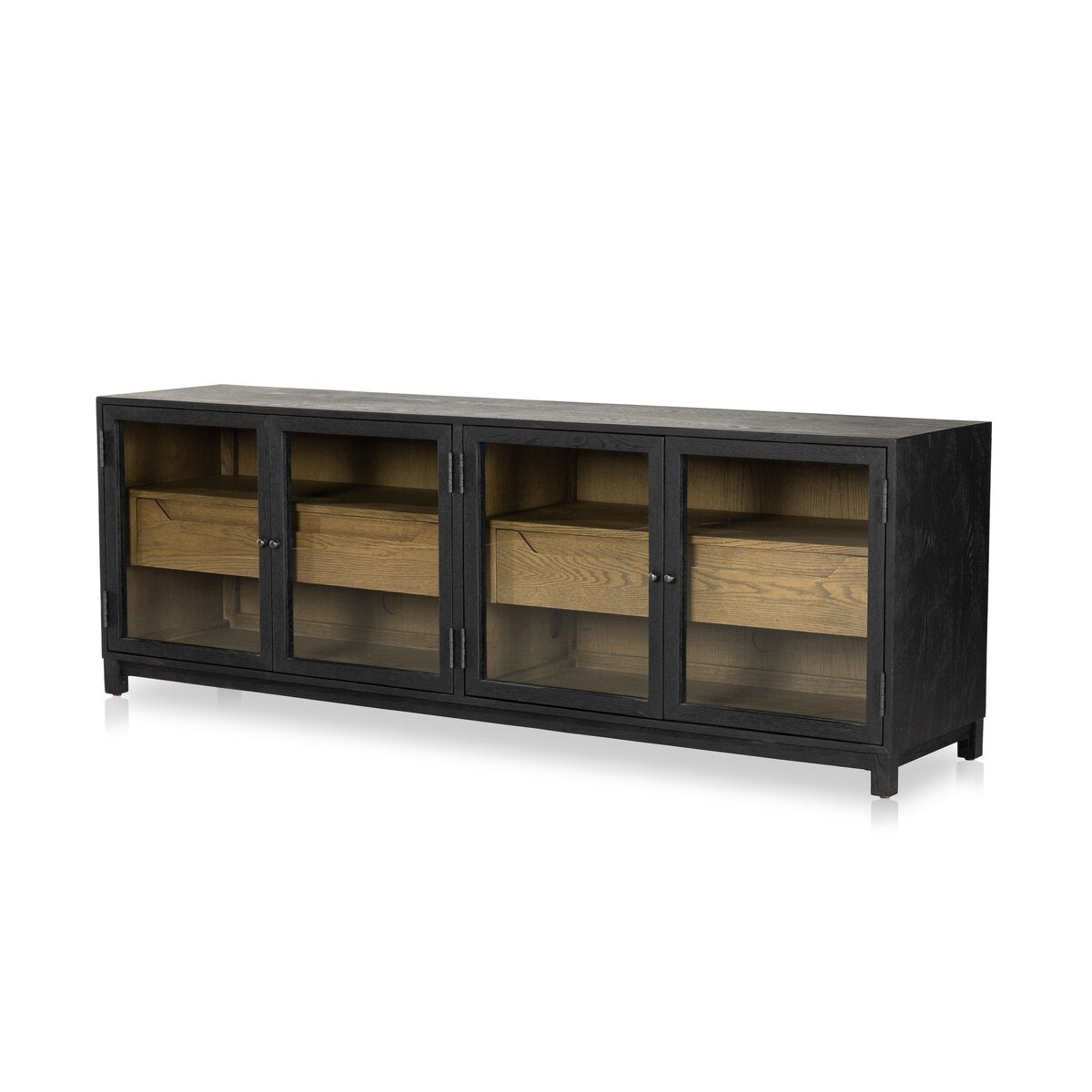 The Two-Tone Glass Media Cabinet features a modern black drifted oak finish with three glass doors that showcase natural wood shelves and interior drawers, photographed against a white background.