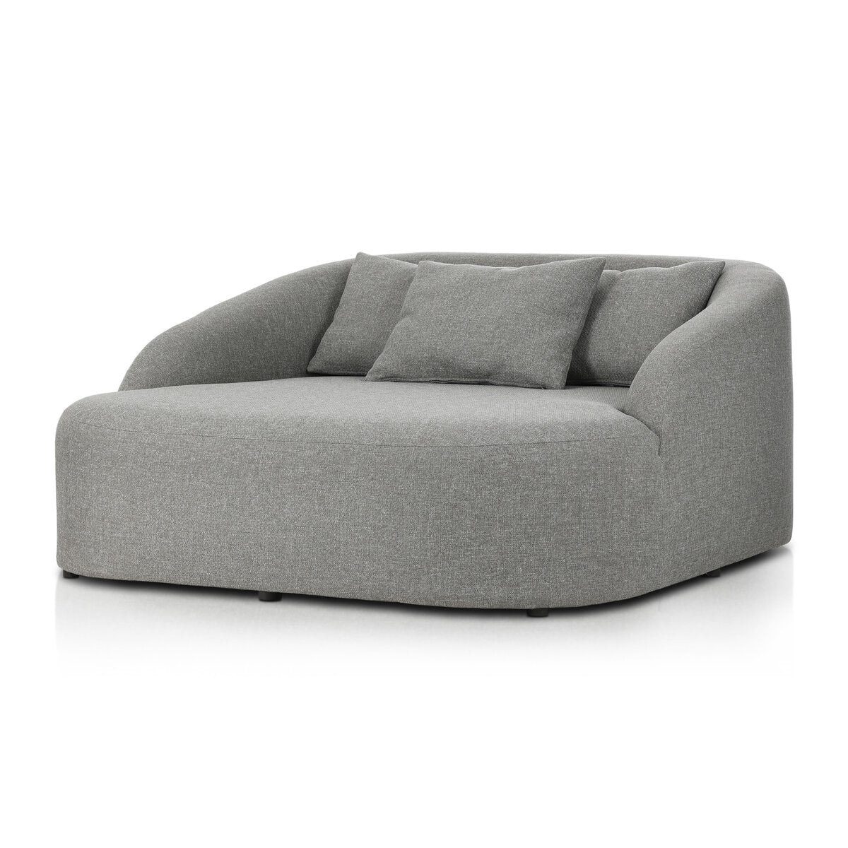 Experience modern comfort with the Outdoor Day Bed, an oversized light gray upholstered chair featuring a rounded backrest, armrests, two matching square pillows, and a rectangular pillow—showcasing minimalist, contemporary style inspired by outdoor daybed design.