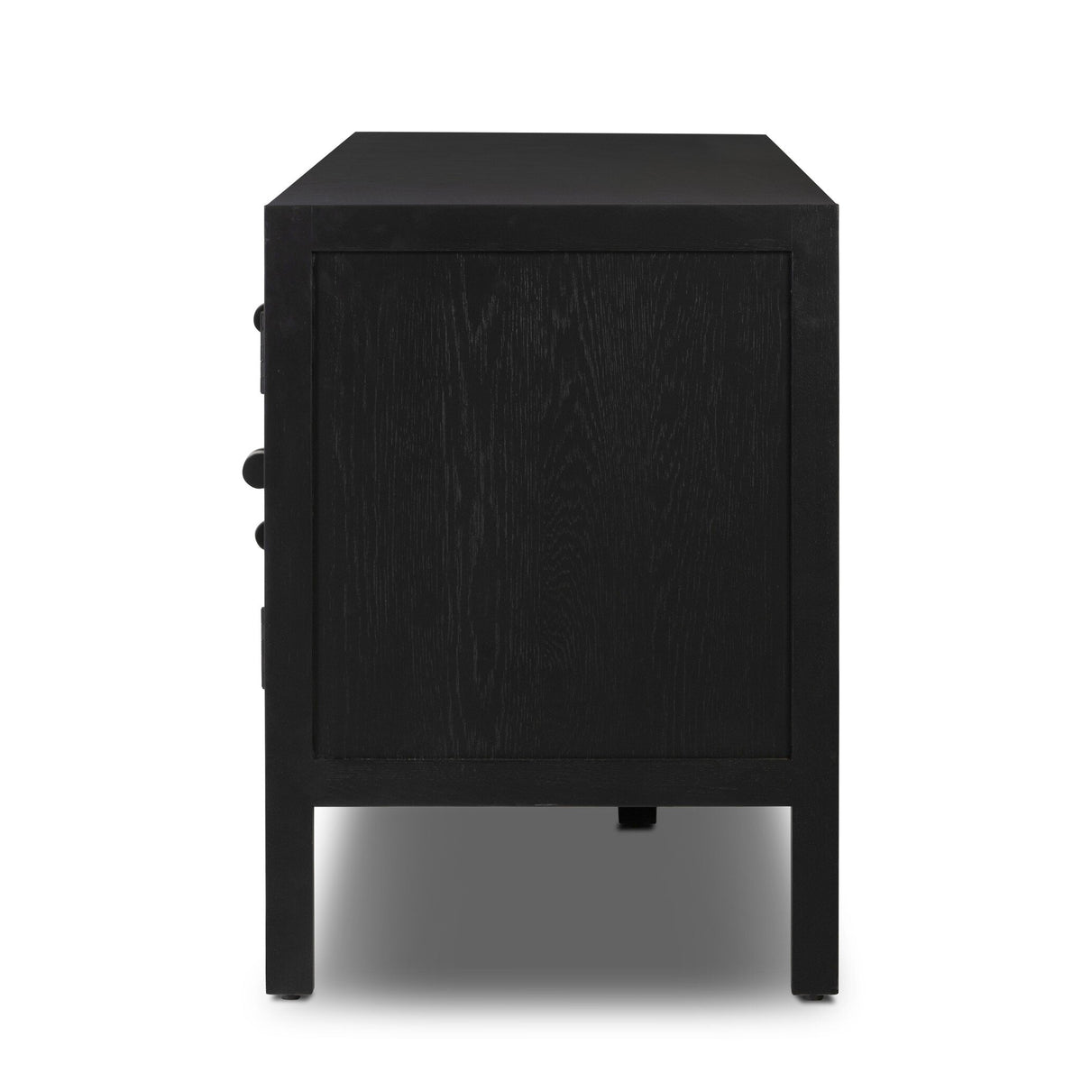 Side view of the Laker Media Console, a black, rectangular wooden cabinet with four legs and a smooth, flat surface. The image highlights one side panel in clear detail against a white background. The overall dimensions are 83.75″w x 18.00″d x 25.00″h.