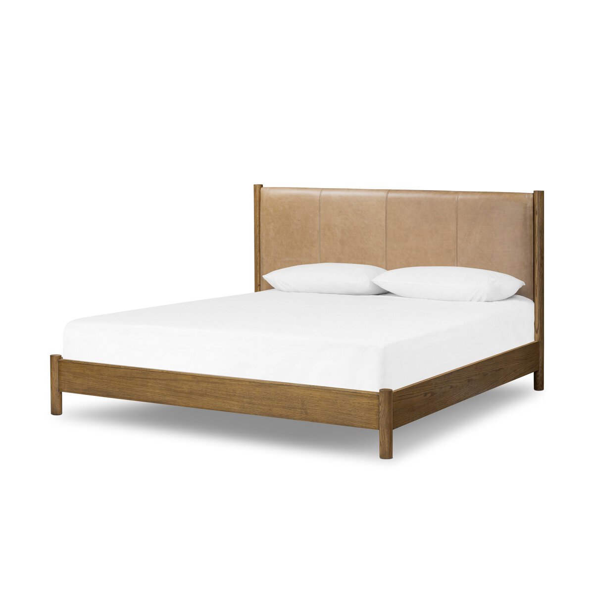 The Roark Bed features a modern wooden frame with a tan upholstered headboard, shown with a white mattress and two pillows. Available in King or Queen sizes; check details for overall dimensions.