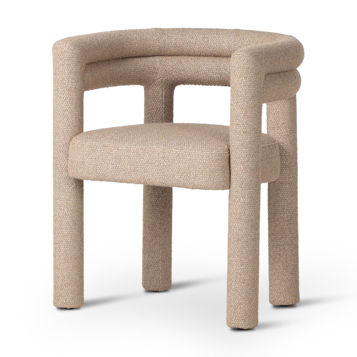 The Tacova Dining Chair is a modern beige ergonomic chair featuring thick, rounded legs, a curved backrest, and soft upholstery, displayed against a plain white background.