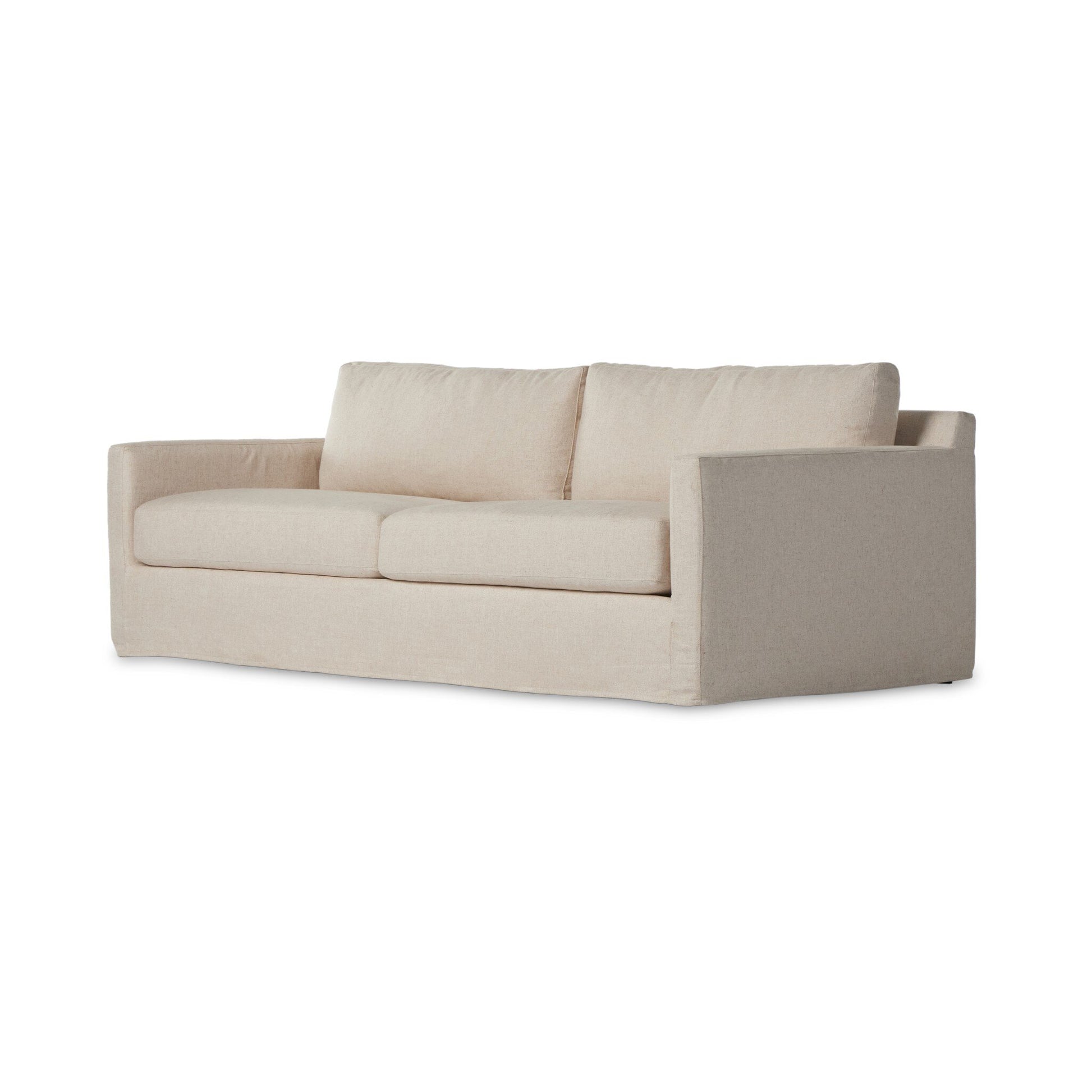 The Hampton Slipcover Sofa is a modern, beige three-seat sofa with straight arms and plush cushions, shown against a white background to emphasize its sleek design.