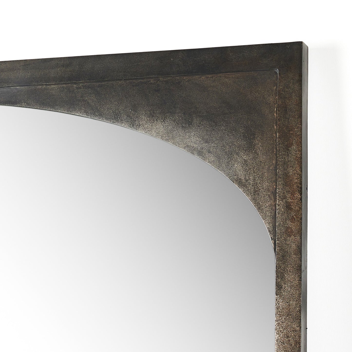 Close-up of the top right corner of the Troyes Floor Mirror, featuring a burnished charcoal metal frame with a gentle inward curve and smooth reflective surface. Overall dimensions: 60x2x79.5 cm. Set against a white background.