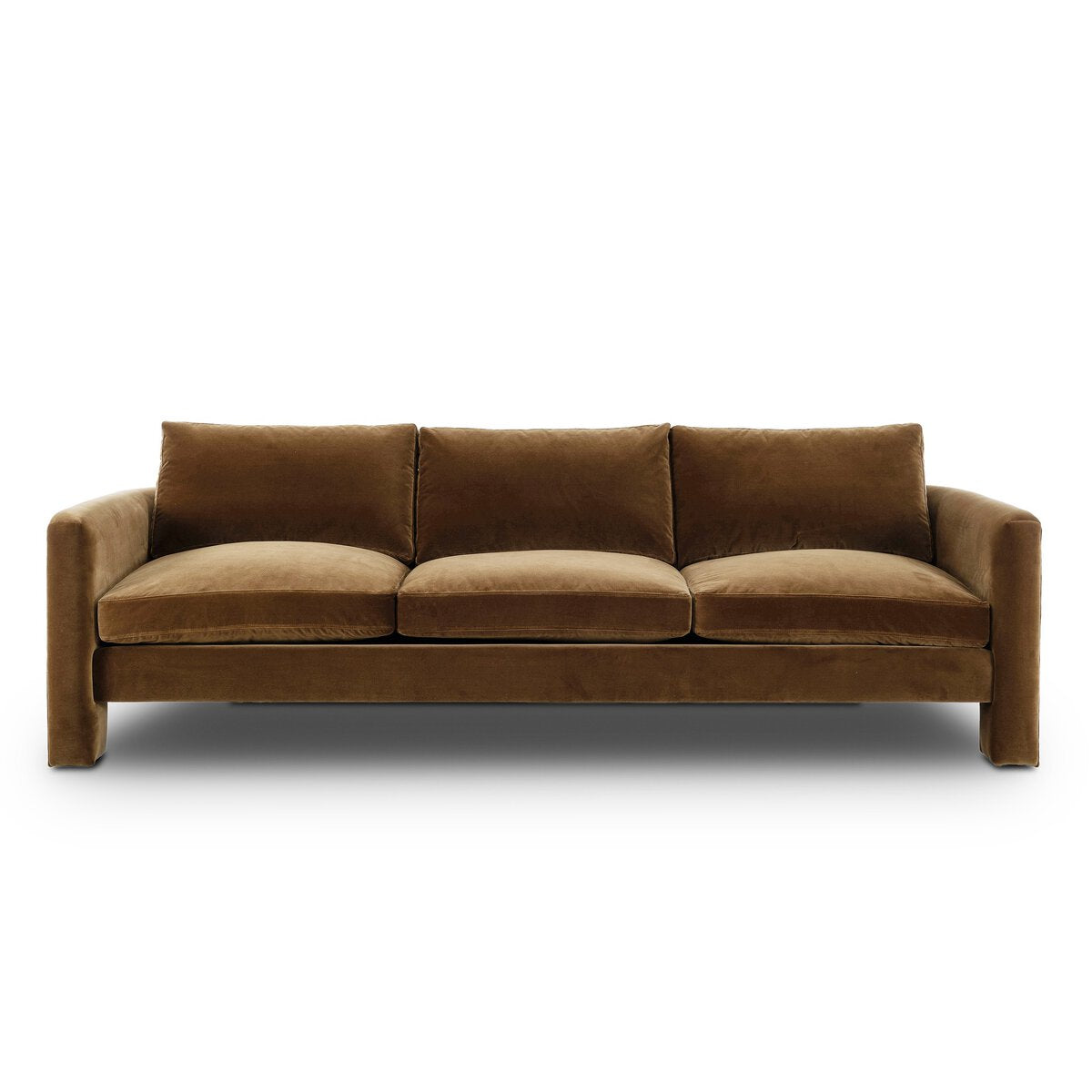 The Katya Sofa is a modern brown velvet piece featuring three seat and back cushions plus wide, slightly curved armrests, set against a plain white background—designed for comfort and style in any space.