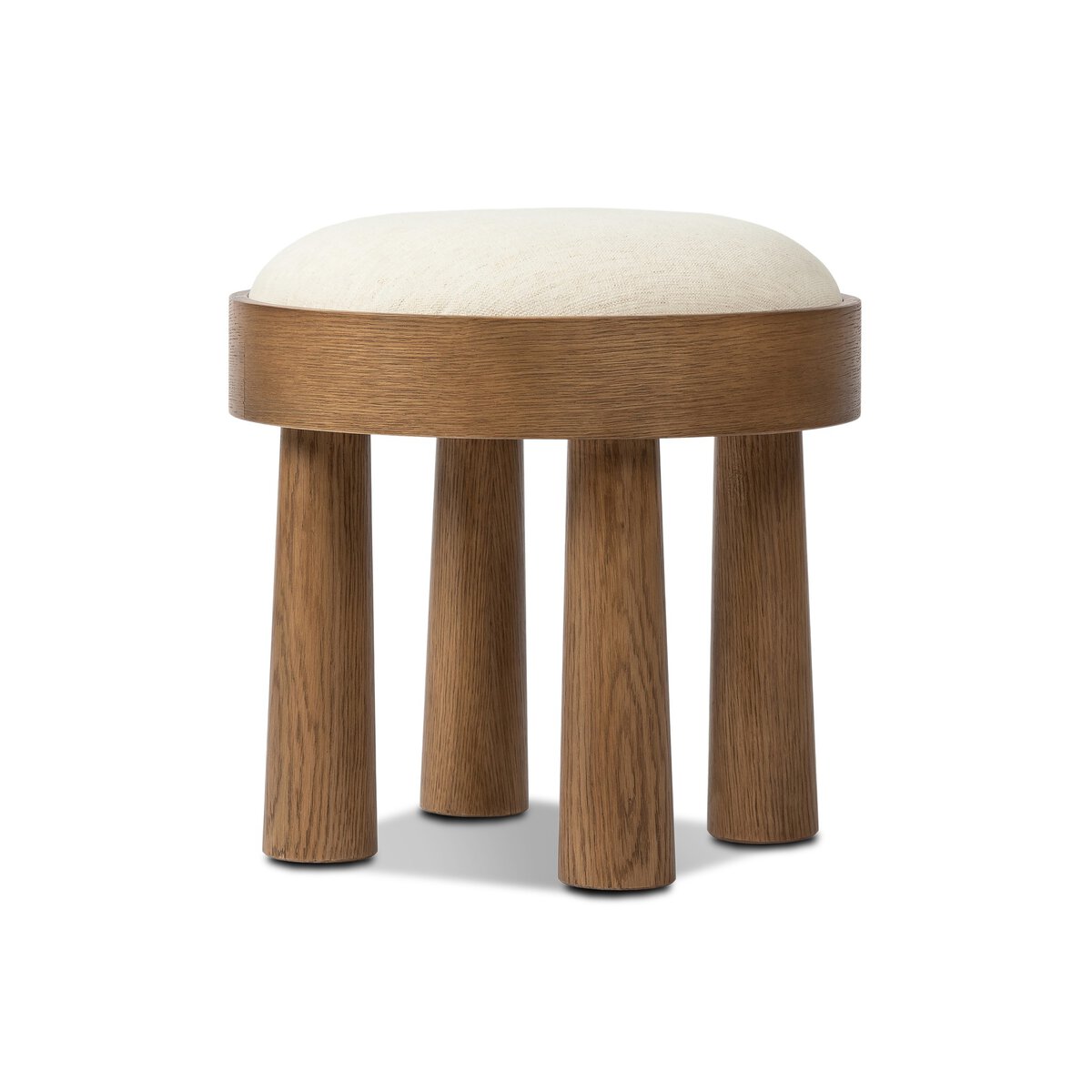 The Louise Accent Stool features a round wooden seat, four thick cylindrical legs, and an off-white upholstered cushion—perfect as a small accent table or extra seating in any room.