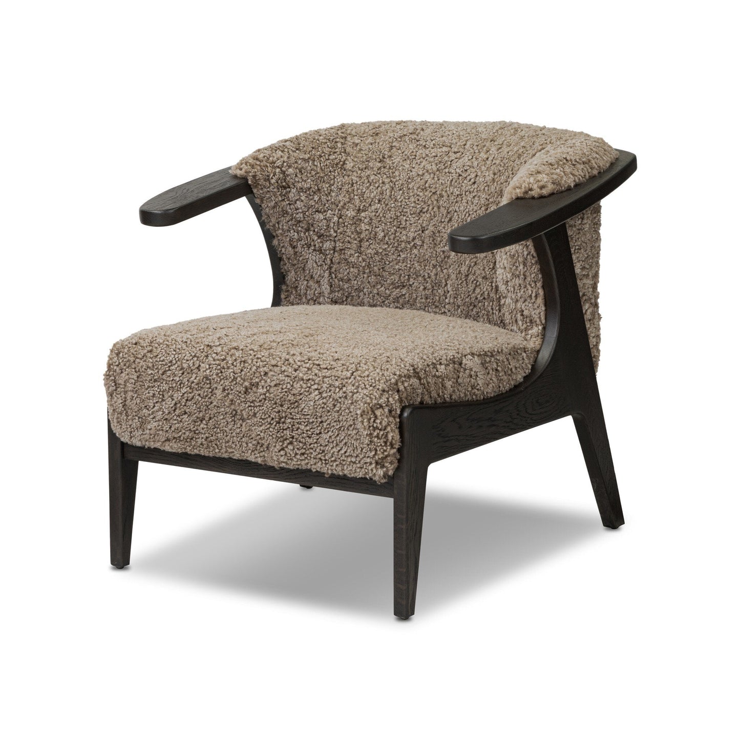 The Fabian Chair features dark wooden legs and frame with plush, textured beige upholstery on the seat, backrest, and inner arms. Its open, angled design and compact size make it perfect for contemporary spaces.