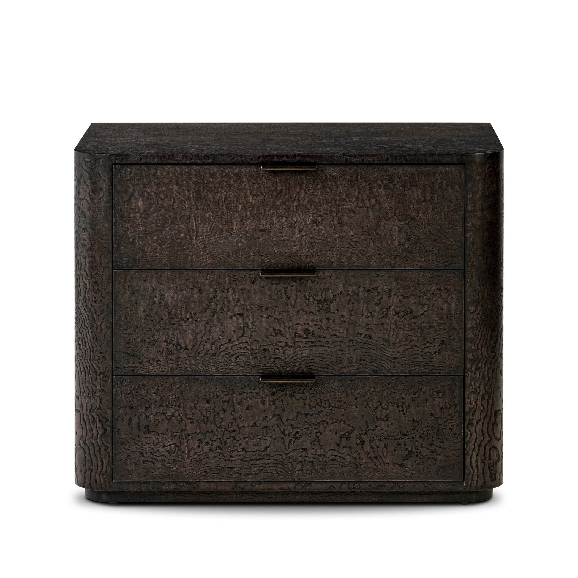 The Stenson 3 Drawer Nightstand features dark wood, three drawers with rectangular pulls, textured wavy grain, and softly rounded corners. Its modern design measures 32"w x 20"d x 26.5"h, perfect for contemporary spaces.