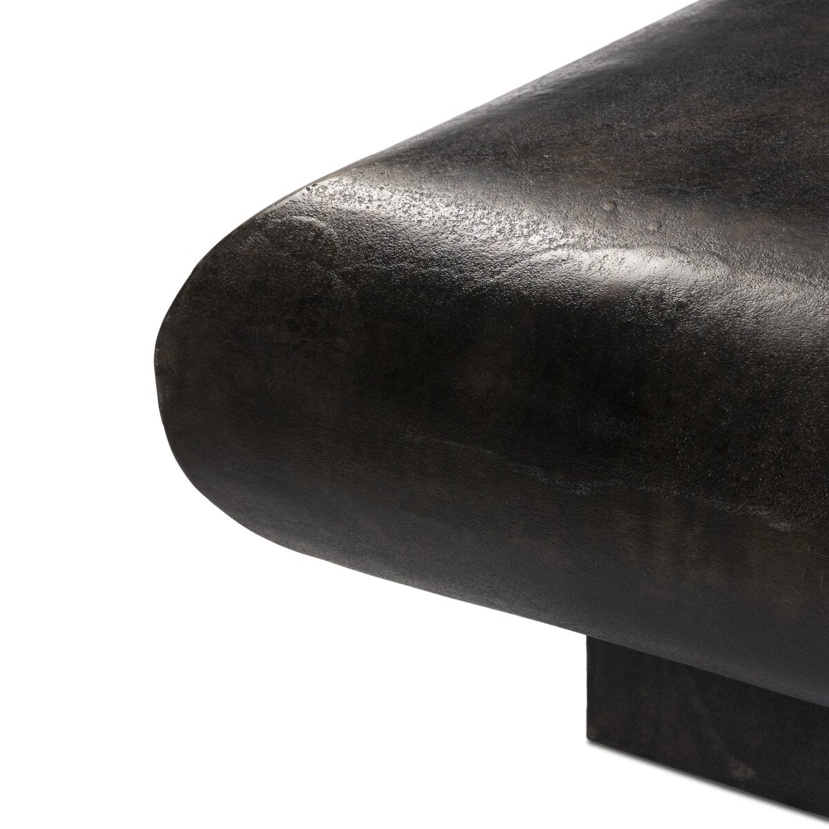 Close-up of the rounded edge of the Square Metal Coffee Table with a dark, slightly textured finish, showcasing its modern design and overall size of 55.50"w x 55.50"d x 14.50"h against a white background.