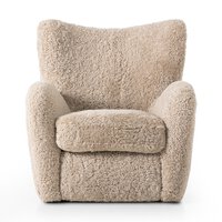 The Amelie Chair is a plush beige armchair with soft, textured fabric and a wide, cushioned seat and backrest, shown against a white background. Overall dimensions: 33.75"w x 38.50"d x 36.50"h.